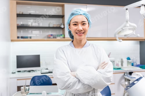 Preview: Portrait of Asian beautiful dentist standing at dental health clinic.