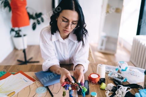 Preview: Female artist with tools at atelier