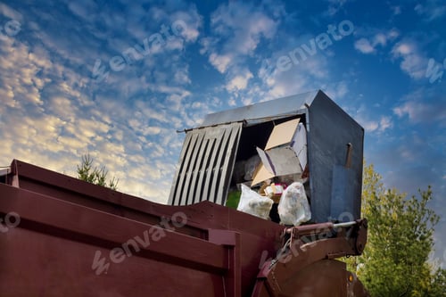 Preview: Lorry truck loading a skip waste management container