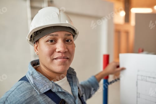 Preview: Female Worker Looking at Camera on Site