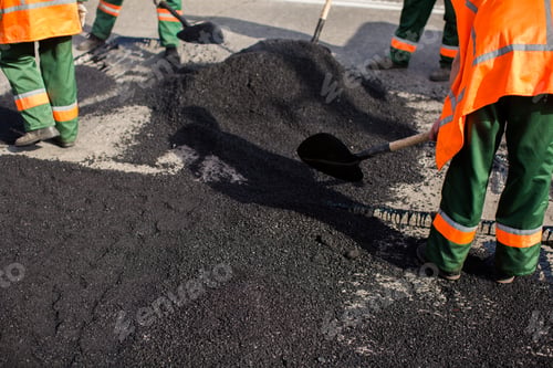 Preview: Workers on Asphalting paver machine during Road street repairing works. Street resurfacing.