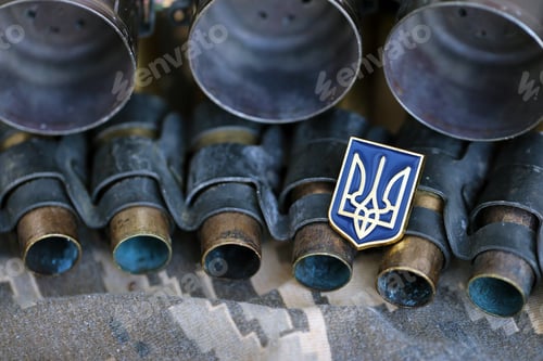 Preview: Ukrainian symbol on machine gun belt lies on ukrainian pixeled military camouflage