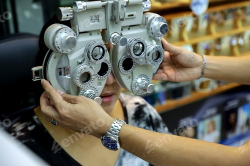 Preview: Phoropter for eye test, lenses glasses for eye check in optical store.