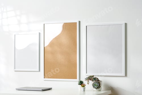 Preview: Three blank frames with copy space hanging on white wall