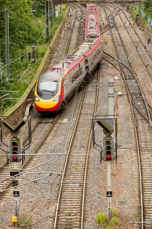 Preview: Train changing tracks at junction on railway tracks.