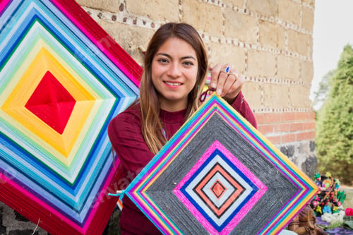 Preview: Hispanic female holding a knitted mandala