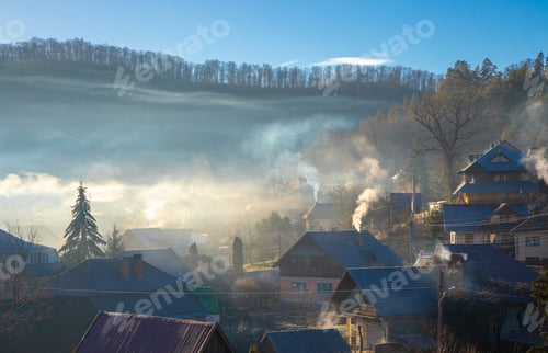 Preview: Smoke from the chimneys of the houses above the village in the morning