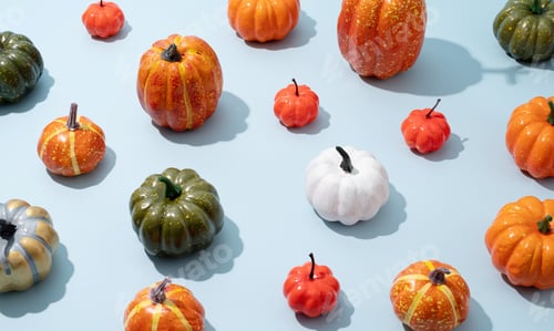 Preview: pattern of colorful artificial pumpkins on blue background