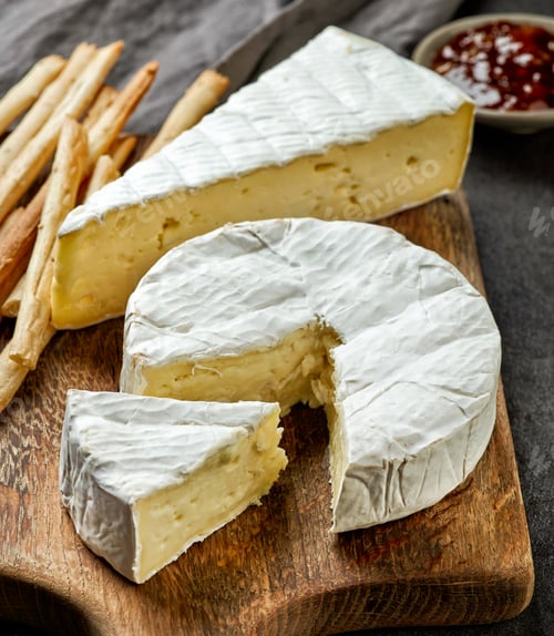 Preview: camembert cheese on wooden cutting board