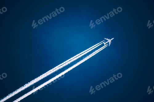 Preview: A jet vapour trail across a dark blue sky.