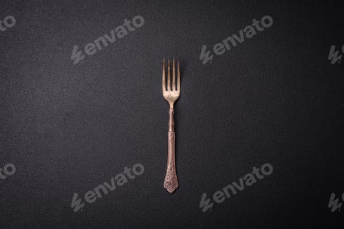 Preview: Kitchen fork made of steel on a dark textured background