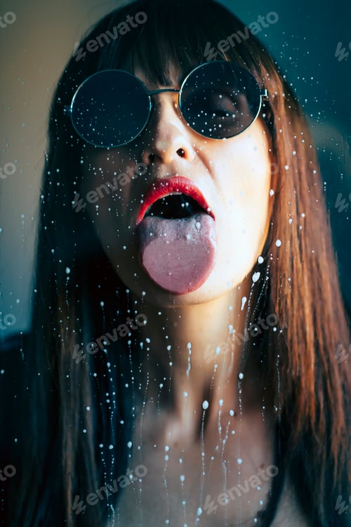 Preview: Sexy woman licking wet glass
