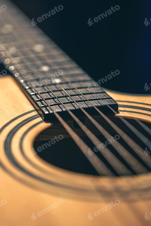 Preview: Close up of guitar and strings with shallow depth of field, soft focus.