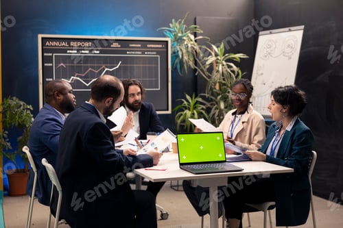 Preview: Promotions specialist and staff members meeting in a boardroom