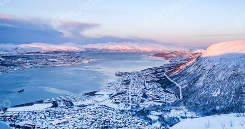 Preview: Aerial view of Tromso, Norway at sunset in winter from Storsteinen mountain.