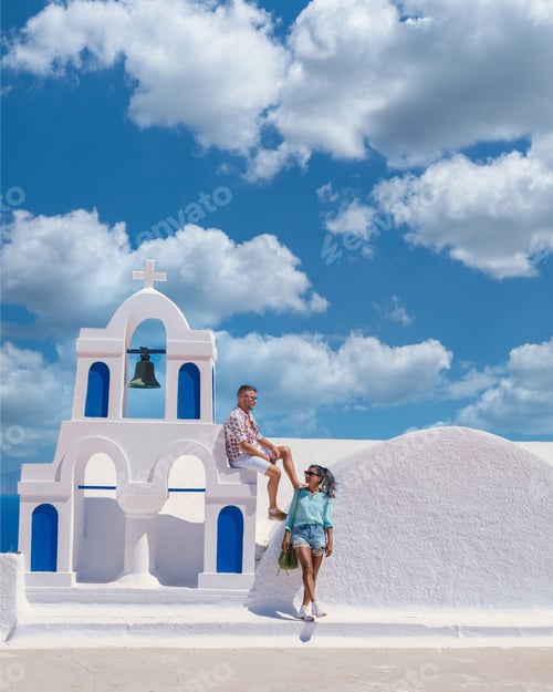 Preview: Couple visit Santorini Greece, men and women visit the whitewashed Greek village of Oia