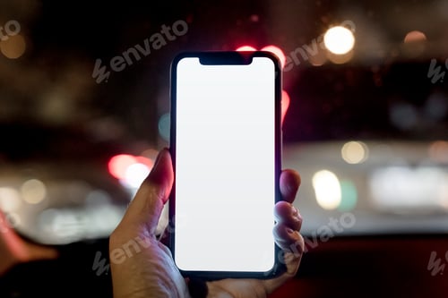 Preview: Guy holding a blank smartphone screen while walking in the city