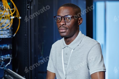 Preview: Two People Inspecting Server Network