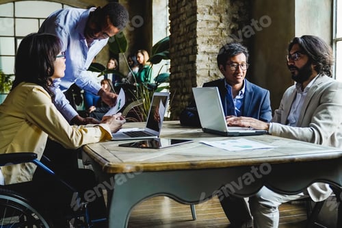 Preview: Multiracial diverse business people working on financial project at meeting office
