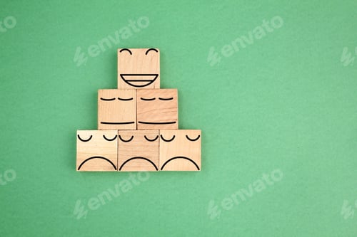 Preview: wooden cube with a happy face icon on top and a sad face on the bottom.