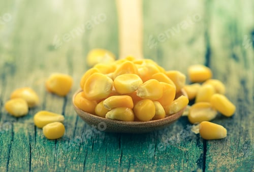 Preview: corn in the spoon on wooden