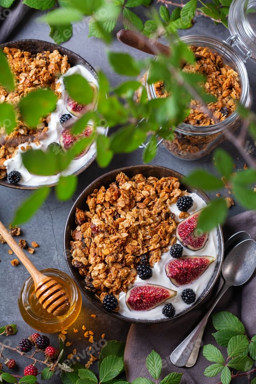 Preview: Homemade oat granola muesli with yogurt and berries for breakfast