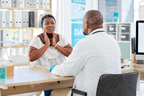 Preview: African american woman talking to doctor about sore throat. Doctor in a consult with sick patient.