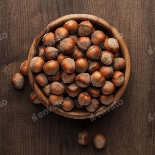 Preview: Hazelnuts In Wooden Bowl On The Brown Table