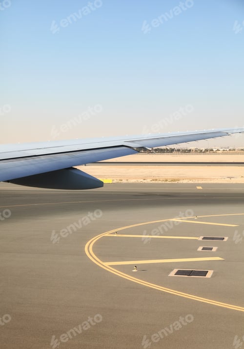 Preview: Wing View on Tarmac at Airport During Day