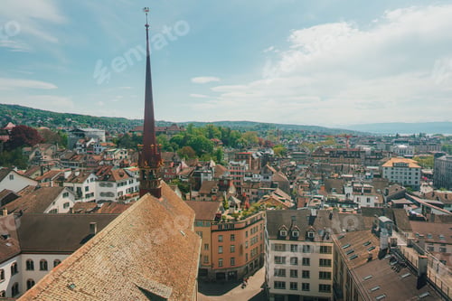 Preview: Aerial view of Zurich's old town with historical buildings and a prominent church spire