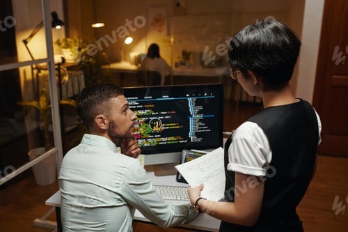 Preview: Designer and Developer Discussing Work