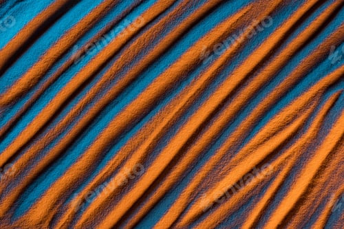 Preview: top view of abstract wavy background with textured sand and color filter