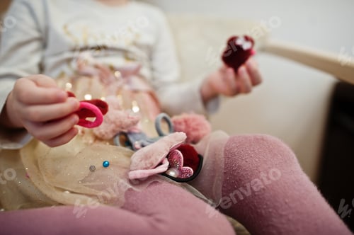 Preview: Mom making hairstyle, girl with hairpins.