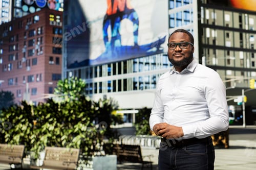 Preview: Portrait of black adult walking around busy downtown area and sidewalk