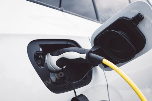 Preview: The electric car charger plugged in to the socket, the modern electric car charging