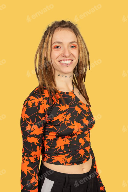 Preview: Young woman with dreadlocks smiling cheerfully