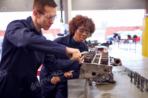Preview: Male And Female Students Work On Car Engine Block On Auto Mechanic Apprenticeship Course At College