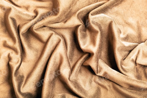 Preview: Wrinkled golden brown fabric background close up