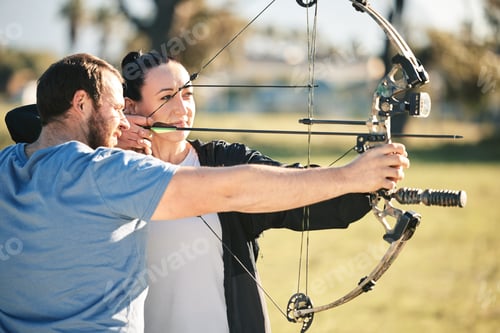 Preview: Archery, aim and shooting range sports training with a woman and man outdoor for target practice. A