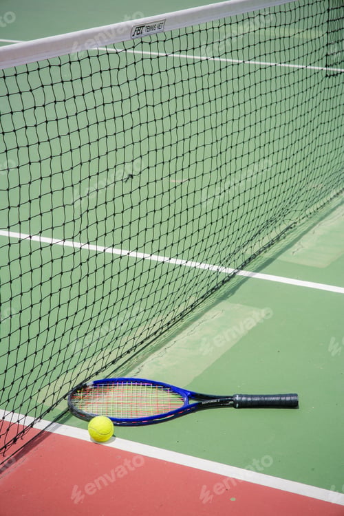 Preview: tennis racket and balls on the tennis court