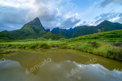 Preview: Paddy rice terraces, green agricultural fields in countryside of mountain hills valley, Vietnam.