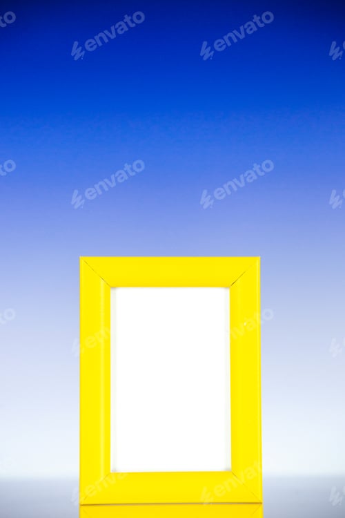 Preview: front view yellow picture frame on light blue background family color gift present photo shoot