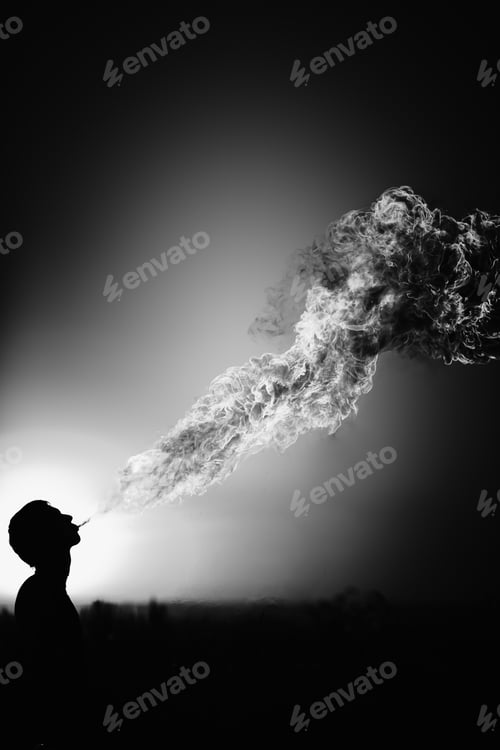 Preview: Man spits fire in gray tones
