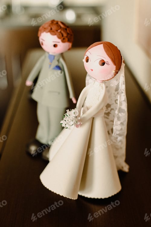 Preview: Elegant Wedding Cake Toppers on Display Indoors