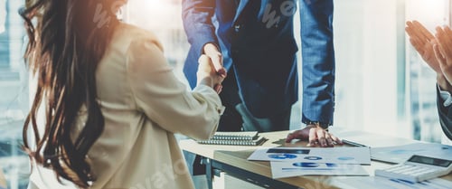 Preview: business people handshake at meeting table in office together with confident. Young businessman and