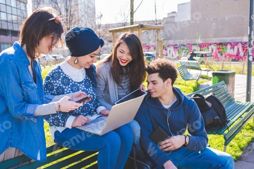 Preview: Multiracial group young people using computer