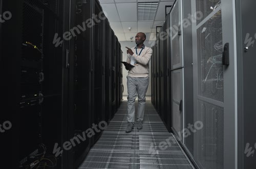 Preview: Technician, cybersecurity and man in the server room for data maintenance, it or analysis. System,