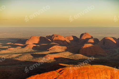 Preview: Aerial view of large sandstone formations at sunset. Uluru-Kata Tjuta National Park, Australia