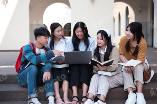 Preview: Group of students studying on campus outdoors