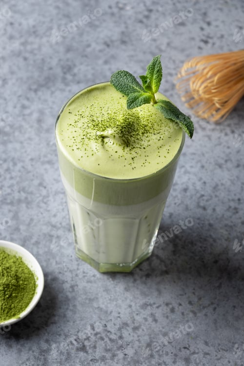 Preview: Dalgona Iced Matcha tea. Whipped white eggs with matcha tea is added to milk with ice.